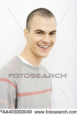 Stock Photograph - young man smiling 
at camera, portrait. 
fotosearch - search 
stock photos, 
pictures, images, 
and photo clipart