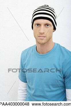 Stock Photo - young man wearing 
knit hat, portrait. 
fotosearch - search 
stock photos, 
pictures, images, 
and photo clipart