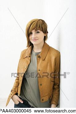 Stock Image - young woman standing 
with hand in pocket, 
portrait. fotosearch 
- search stock 
photos, pictures, 
images, and photo 
clipart