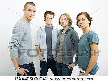 Stock Photo - group of young 
adults standing 
with hands on 
hips, looking 
at camera. fotosearch 
- search stock 
photos, pictures, 
images, and photo 
clipart