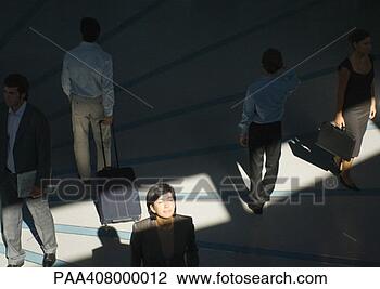 Stock Photo - businesswoman 
standing with 
eyes closed in 
ray of sunlight 
while. fotosearch 
- search stock 
photos, pictures, 
images, and photo 
clipart