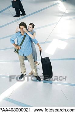 Stock Photography - young woman standing 
behind male friend, 
 covering eyes, 
 full. fotosearch 
- search stock 
photos, pictures, 
images, and photo 
clipart