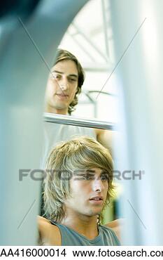 Stock Photo - man lifting barbell 
while second man 
spots him. fotosearch 
- search stock 
photos, pictures, 
images, and photo 
clipart
