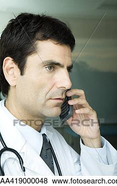 Stock Photo - doctor making 
phone call. fotosearch 
- search stock 
photos, pictures, 
images, and photo 
clipart