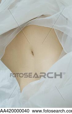 Stock Photography - woman's abdomen, 
surrounded by 
sheer fabric, 
full frame. fotosearch 
- search stock 
photos, pictures, 
images, and photo 
clipart