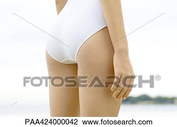 Stock Photo - teenage girl wearing 
bathing suit, 
rear view, mid 
section. fotosearch 
- search stock 
photos, pictures, 
images, and photo 
clipart