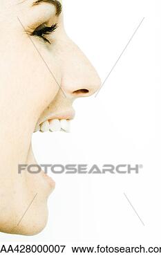 Picture - young woman's 
face with mouth 
wide open, profile. 
fotosearch - search 
stock photos, 
pictures, images, 
and photo clipart