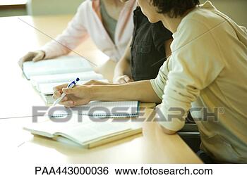 Stock Photo - college students 
sitting at table 
studying, partial 
view. fotosearch 
- search stock 
photos, pictures, 
images, and photo 
clipart