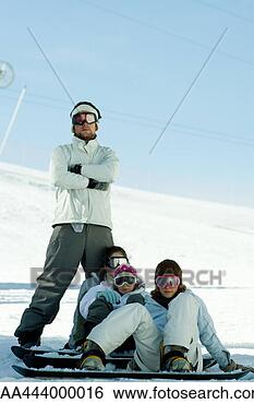 Stock Photo - young snowboarders 
on ski slope, 
full length portrait. 
fotosearch - search 
stock photos, 
pictures, images, 
and photo clipart