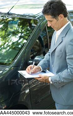Stock Photo - insurance adjuster 
inspecting car. 
fotosearch - search 
stock photos, 
pictures, images, 
and photo clipart