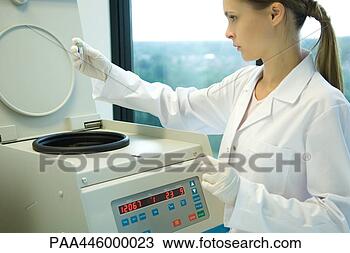 Stock Photo - young female researcher 
using centrifuge. 
fotosearch - search 
stock photos, 
pictures, images, 
and photo clipart