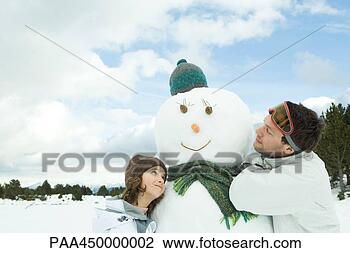 Stock Photo - brother and sister 
embracing snowman, 
smiling, head 
and shoulders. 
fotosearch - search 
stock photos, 
pictures, images, 
and photo clipart