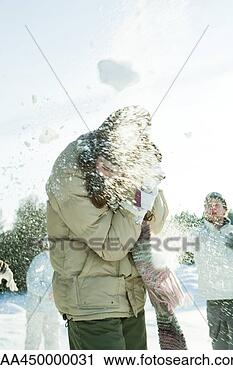 Stock Photography - young friends 
throwing snowballs 
at each other, 
blurred motion. 
fotosearch - search 
stock photos, 
pictures, images, 
and photo clipart