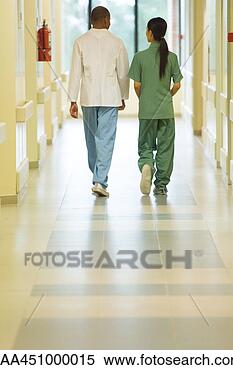 Stock Image - hospital staff 
walking side by 
side, rear view, 
full length. fotosearch 
- search stock 
photos, pictures, 
images, and photo 
clipart