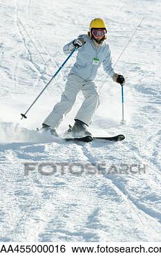 Stock Photo - teenage girl skiing 
down ski slope, 
full length. fotosearch 
- search stock 
photos, pictures, 
images, and photo 
clipart