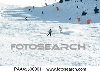 Stock Photography - young skiers on 
ski slope, in 
the distance. 
fotosearch - search 
stock photos, 
pictures, images, 
and photo clipart