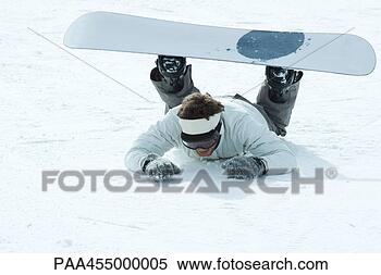 Stock Image - young snowboarder 
fallen on the 
ground, full length. 
fotosearch - search 
stock photos, 
pictures, images, 
and photo clipart