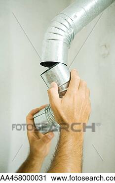 Stock Photography - man repairing 
air duct, cropped 
view of hands. 
fotosearch - search 
stock photos, 
pictures, images, 
and photo clipart