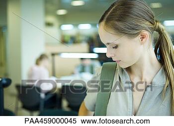 Stock Image - female student 
looking down, 
head and shoulders. 
fotosearch - search 
stock photos, 
pictures, images, 
and photo clipart