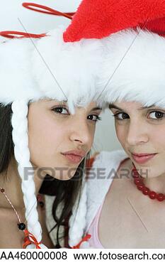 Banco de Imagem - dois,  jovem, 
 femininas,  amigos, 
 vestido,  natal, 
 trajes,  olhar. 
fotosearch - busca 
de fotos, imagens 
e clipart
