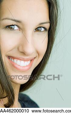 Stock Photography - female smiling 
at camera, portrait. 
fotosearch - search 
stock photos, 
pictures, images, 
and photo clipart