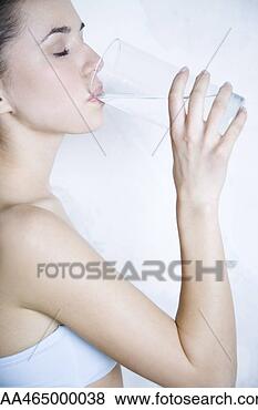 Stock Photo - woman drinking 
water, eyes closed, 
side view. fotosearch 
- search stock 
photos, pictures, 
images, and photo 
clipart