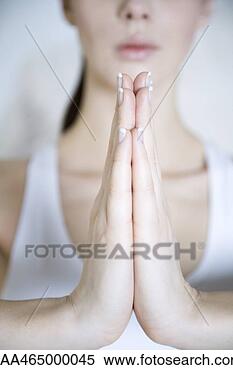 Stock Image - woman in prayer 
position, cropped 
view of hands. 
fotosearch - search 
stock photos, 
pictures, images, 
and photo clipart
