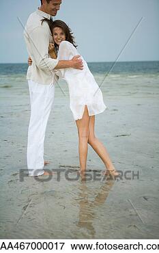 Picture - teen girl leaning 
against man's 
chest, smiling 
at camera. fotosearch 
- search stock 
photos, pictures, 
images, and photo 
clipart