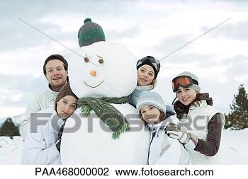 Stock Photo - group of young 
friends gathered 
around snowman. 
fotosearch - search 
stock photos, 
pictures, images, 
and photo clipart