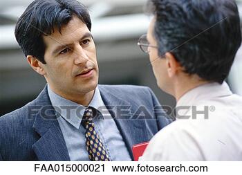 Stock Photography - businessmen talking 
face to face, 
head and shoulders. 
fotosearch - search 
stock photos, 
pictures, images, 
and photo clipart