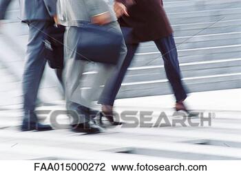 Stock Photo - businesspeople 
crossing street, 
low section. fotosearch 
- search stock 
photos, pictures, 
images, and photo 
clipart