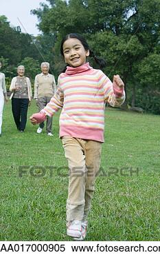 Stock Image - girl dancing while 
family watches 
in background. 
fotosearch - search 
stock photos, 
pictures, images, 
and photo clipart