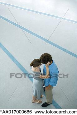 Stock Photo - young couple embracing, 
full length, high 
angle view. fotosearch 
- search stock 
photos, pictures, 
images, and photo 
clipart