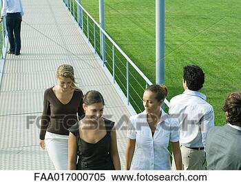 Stock Image - young professionals 
walking and standing 
on walkway. fotosearch 
- search stock 
photos, pictures, 
images, and photo 
clipart