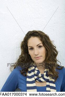 Stock Photo - young woman looking 
at camera, portrait, 
white background. 
fotosearch - search 
stock photos, 
pictures, images, 
and photo clipart