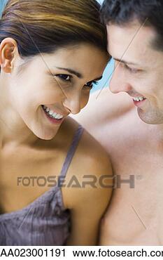 Stock Photography - couple with heads 
close together, 
 smiling,  cropped 
view of heads. 
fotosearch - search 
stock photos, 
pictures, images, 
and photo clipart
