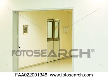 Stock Image - hospital corridor, 
view through doorway. 
fotosearch - search 
stock photos, 
pictures, images, 
and photo clipart
