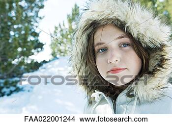 Stock Photo - teenage girl wearing 
parka in snowy 
landscape, portrait. 
fotosearch - search 
stock photos, 
pictures, images, 
and photo clipart