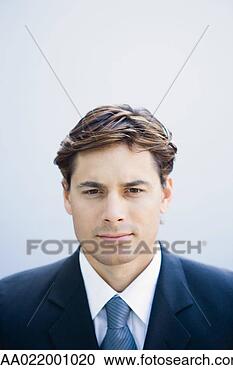 Stock Photography - young businessman 
looking at camera, 
portrait, head 
and shoulders. 
fotosearch - search 
stock photos, 
pictures, images, 
and photo clipart