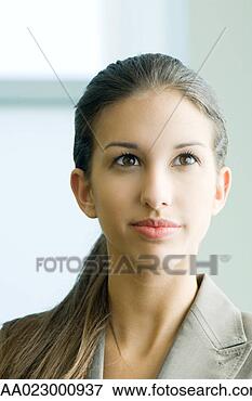 Picture - young female in 
business attire 
smiling, looking 
up, portrait. 
fotosearch - search 
stock photos, 
pictures, images, 
and photo clipart