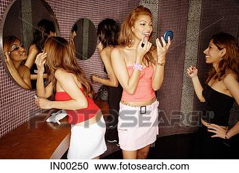 Stock Photography - women applying 
make-up in bathroom. 
fotosearch - search 
stock photos, 
pictures, images, 
and photo clipart
