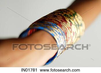 Stock Photography - close-up of woman's 
arm with colourful 
bangles. fotosearch 
- search stock 
photos, pictures, 
images, and photo 
clipart