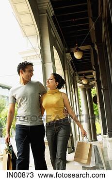 Stock Photo - couple walking, 
side by side, 
looking at each 
other. fotosearch 
- search stock 
photos, pictures, 
images, and photo 
clipart