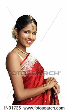 Stock Photo - woman in traditional 
indian costume 
standing against 
white background. 
fotosearch - search 
stock photos, 
pictures, images, 
and photo clipart
