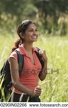 Stock Photo - young woman hiking 
in the wilderness. 
fotosearch - search 
stock photos, 
pictures, images, 
and photo clipart