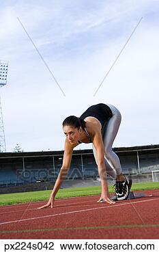 Stock Photo - runner in starting 
block. fotosearch 
- search stock 
photos, pictures, 
images, and photo 
clipart