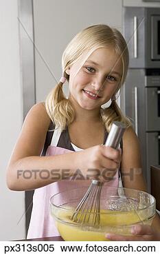 Stock Image - girl whisking 
bowl of batter. 
fotosearch - search 
stock photos, 
pictures, images, 
and photo clipart