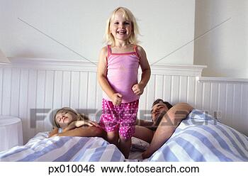 Stock Photo - family, house, 
bed. fotosearch 
- search stock 
photos, pictures, 
images, and photo 
clipart