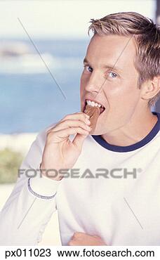 Stock Photo - man, food, sweet. 
fotosearch - search 
stock photos, 
pictures, images, 
and photo clipart