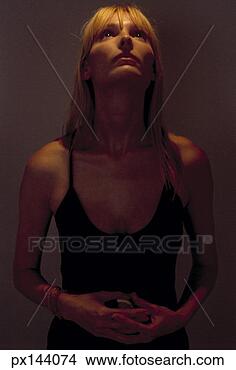 Stock Photo - woman looking 
up at a light. 
fotosearch - search 
stock photos, 
pictures, images, 
and photo clipart